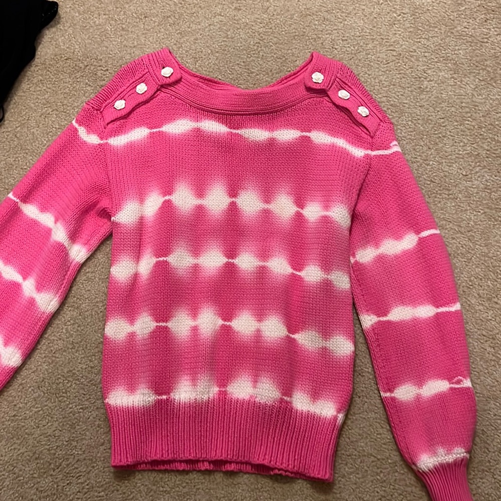 Love Shack Fancy sweater with rose buttons.